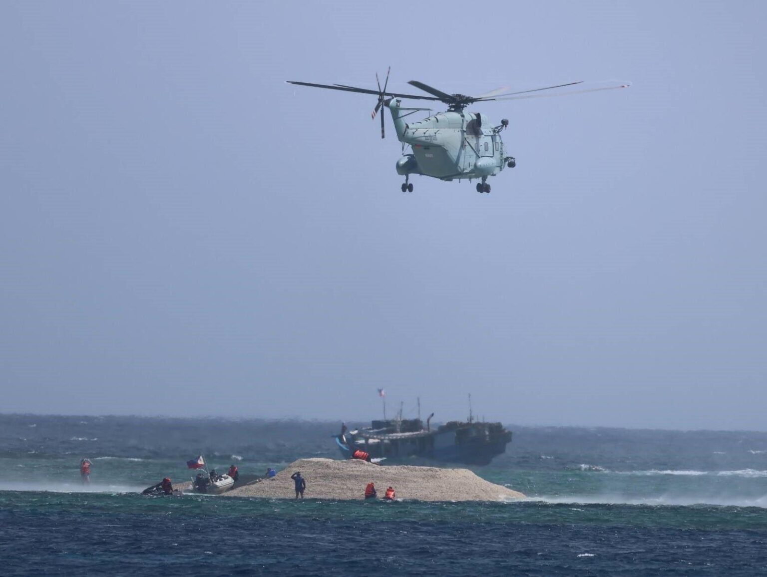 Chinese Helicopter Harasses Filipino Fishermen in Disputed South China Sea